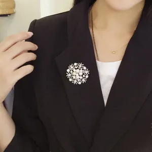 Stunning crystal pearl snowflake brooch pin, elegant lapel accessory for winter and party.