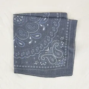 Detail shot of a soft blue floral paisley square scarf, elegant accessory for women.