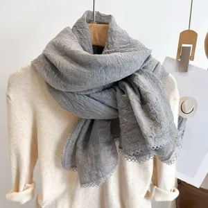 Detailed view of the Korean style solid color pleated thin scarf with elegant lace trim.