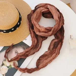 Brown gradient scarf detail shot, elegant fabric texture and chic styling flat lay prop.