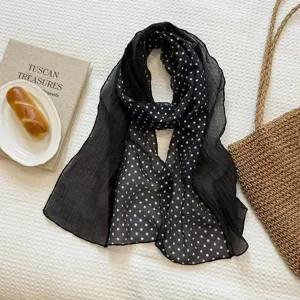Black and white polka dot scarf, lightweight and breathable fabric, perfect for stylish layering.