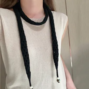 Solid color long knit hollow scarf with bead ends, stylish vibrant fashion women accessory.