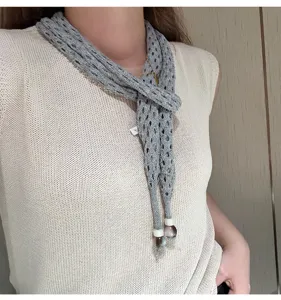 Grey hollow knit scarf detail view, elegant accessory for women, stylish neck warmer with beads