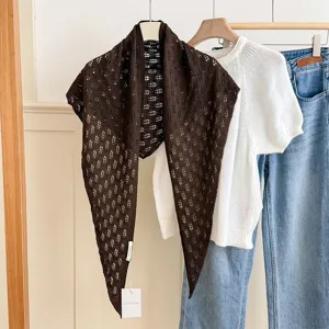Solid color hollow knit triangular scarf for women, trendy summer neck accessory and stylish versatile wrap.