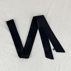 Black thin long ribbon scarf, versatile wavy design for elegant hair tie or bag decoration.