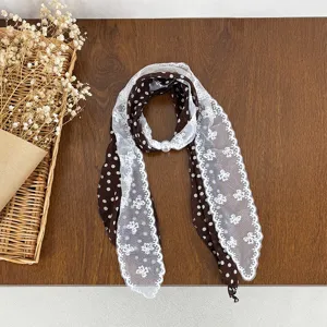 Brown polka dot scarf with white lace splice and pearl ring, versatile spring neckerchief.