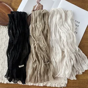 Detailed view of the Korean style pleated slim long scarf in black, khaki, and white.