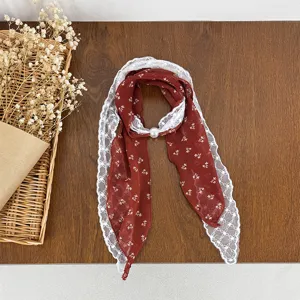 Red floral chiffon scarf with white lace splice and pearl decor, elegant neck accessory.