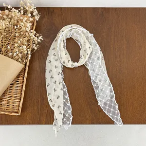 Floral lace scarf detail, elegant neckerchief with pearl accent, vintage literary style.