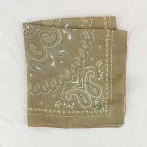 Detailed view of khaki paisley square scarf, vintage floral pattern cotton fabric.