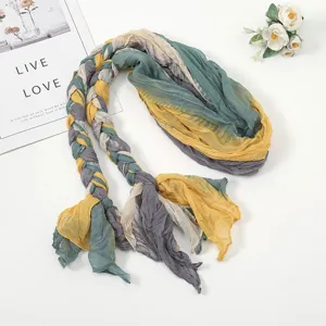 Detailed view of the stylish pleated braided scarf featuring a multi-color patchwork design.