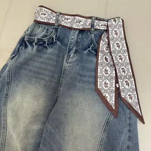 Retro vintage wash denim pants paired with chic printed ribbon belt for stylish daily wear.
