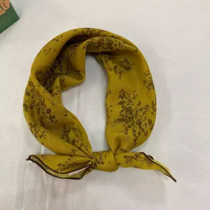 Detailed view of retro printed cotton linen small square scarf, mustard yellow neck scarf