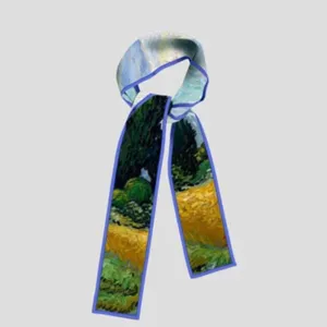 Close-up detail of the art printed narrow silk scarf showing the delicate blue edge and texture.