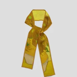 Close-up detail of the art print narrow silk scarf showing sunflower patterns clearly.