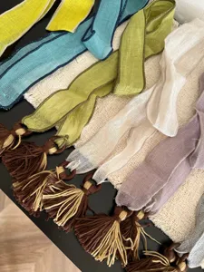 Closeup detail of the lightweight spring summer tassel neck ribbon scarf with boho fringe.