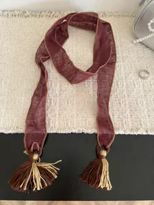Detailed view of the vintage forest-style long ribbon scarf with delicate tassel ends.