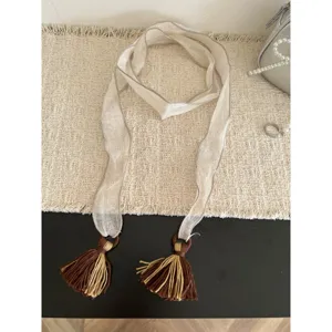 Long sheer ribbon scarf with chic tassels, perfect aesthetic accessory for spring and summer wear.