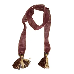 Vintage style long ribbon scarf with tassel ends, lightweight fabric, elegant neck accessory.