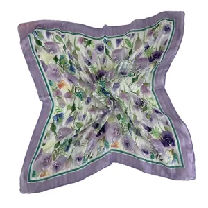 Close-up detail of the elegant purple floral square silk scarf, highlighting the print.