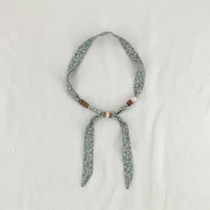 Vintage floral fabric ribbon necklace with wooden beads, exquisite detailed fashion accessory.
