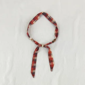 Vintage plaid fabric scarf necklace with wooden beads, elegant retro style accessory for daily wear.