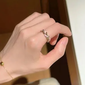 Elegant pink woven leather and gold chain ring, fashion stackable finger jewelry for women.