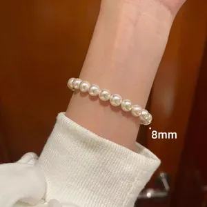 Pulsera de perlas blancas 8mm elegante para mujer cadena elástica de cuentas finas.