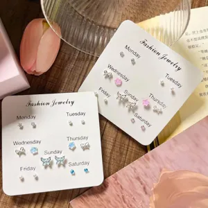 Cute weekly earring set featuring butterflies, stars, and pearls on cards for daily style.