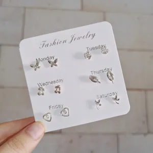 Delicate silver stud earrings set featuring butterfly flower and geometric designs for daily commute