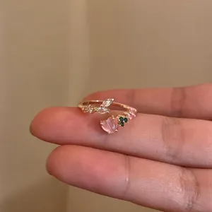 Sweet open ring with pink heart zircon and leaf details, detailed view for women.