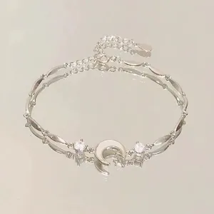 Pulsera plateada de luna y estrella para mujer, elegante joya minimalista de circonita.