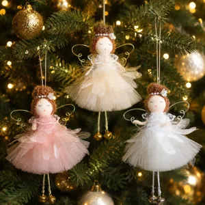 Detailed view of handmade Christmas angel doll ornaments featuring fluffy hair and tulle skirts.