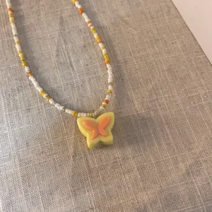 Sweet candy color beaded necklace with yellow butterfly pendant, cute girlish clavicle jewelry.