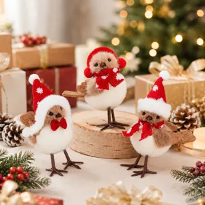 Close-up detail of cute Christmas plush bird figurines with red Santa hats and festive scarves.