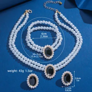 Elegante set di gioielli con collana bracciale e orecchini di perle multistrato con pietra nera.