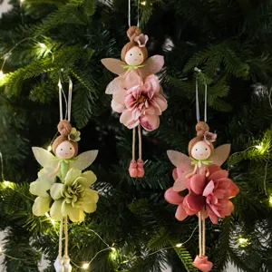 Detailed view of handmade flower fairy hanging ornaments for Christmas tree decor, cute angels.