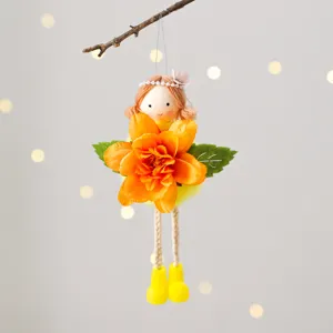 Easter angel doll hanging ornament detail, featuring bright orange artificial flower and boots.