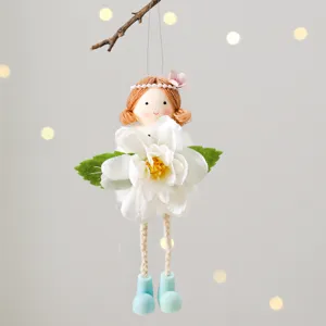 Handmade angel girl hanging decoration with white flower for lovely Easter spring home decor detail.