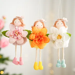 Detailed view of cute flower fairy angel girl hanging ornaments, fabric doll decor for party.