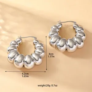 Orecchini a cerchio in metallo segmentato per donna, design croissant vintage, gioielli eleganti.