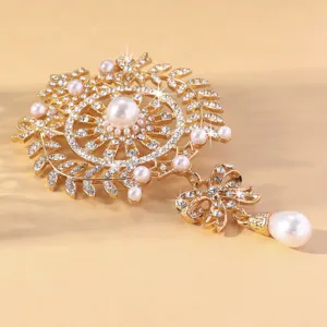 Élégante broche dorée en strass et perles avec pendentif nœud corsage cristal exquis