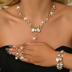 Set di gioielli da sposa placcato oro con collana, orecchini e bracciale di strass floreali.
