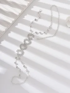 Detailed view of the sparkling rhinestone linked anklet, featuring elegant multi-layer silver chains.