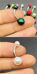 Stainless steel acrylic navel ring body piercing jewelry detail view showing glossy ball.