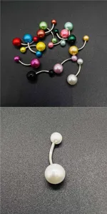 Stainless steel body piercing belly button ring detail with colorful acrylic pearl beads.