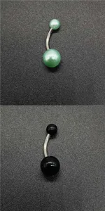 Stainless steel curved belly button ring with glossy acrylic pearl green and black ball beads.