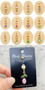 Bonito piercing para ombligo de acero inoxidable con colgante de trébol de circonita.