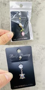 Piercing para ombligo de acero inoxidable con flor de circonita y colgante de tortuga joyería.