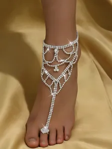 Rhinestone barefoot sandal detail, sparkling crystal anklet for beach vacation style.